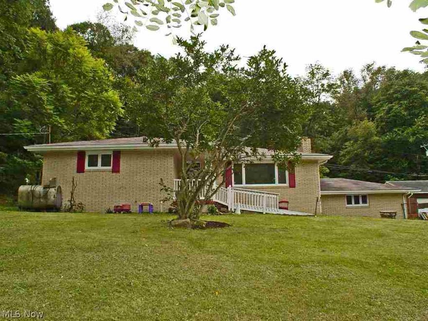 In need of garage space? This solidly built 3 BR, 1 & 3/4 BA brick ranch home has a 2 car attached, 3 car det garage, along with storage sheds on 1 acre of ground. Lg covered porch on the back and a fenced yard. Fresh paint inside. Hardwood under carpet according to seller.