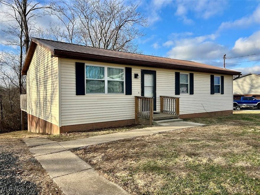 Built in the 1980s, this inviting ranch-style home offers comfortable one-level living with an open floor plan that creates a bright, airy feel. Features include three bedrooms and one full bath.  The dining area has double doors that lead to the rear deck.  You have your choice of two laundry hookups, one in a bedroom on the main floor and one in the basement. 
The full unfinished basement provides endless potential for additional living space, storage, rec room or a workshop.   It also has a part finished room in the basement with a closet that could be used as a bedroom or family room.  In addition, the walkout basement adds convenience and easy access to the outdoors.  Off Street parking and space to build a garage. Set in a peaceful rural setting with a wooded backdrop, this property offers privacy and room to breathe while still providing a solid, well-maintained home ready for your personal touches.  Schedule your appointment to discover the possibilities.