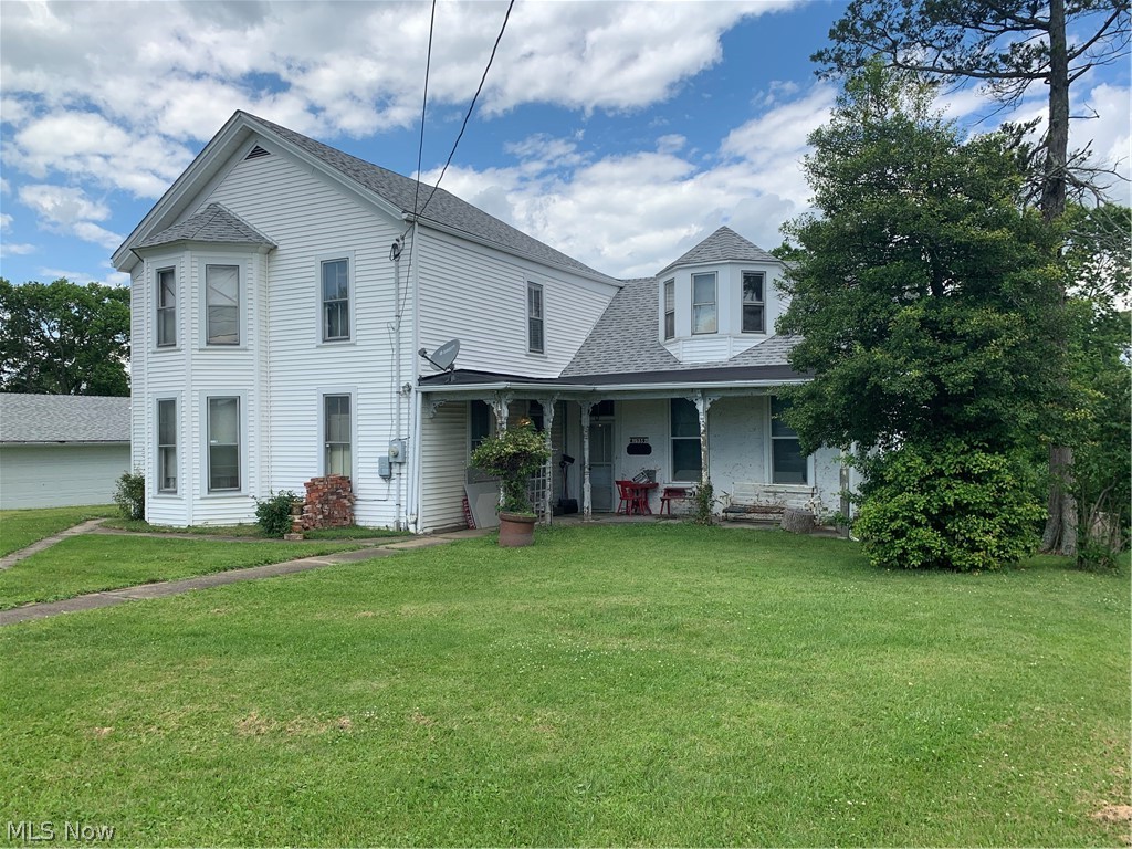 LOCATION! LOCATION! LOCATION! 5.5+ acres with 240+ feet of frontage on Main St in St Clairsville with public hook ups. There is a large home on the property in need of repair. There is also a 3 car garage.