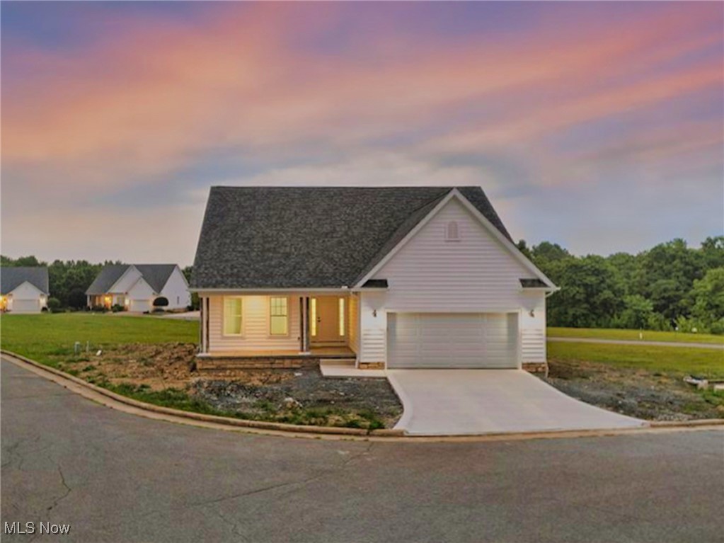 Be the first to move into this BRAND NEW VILLA, in Canfield’s sought-after Saybrook Pointe community. Well designed for low-maintenance living with a high-end finish. Inside, a sun-filled open-concept layout creates an airy sense of space, anchored by a cathedral-ceiling great room and wide plank flooring that runs throughout. The kitchen blends style and function with premium white shaker cabinetry, soft-close doors and drawers, a large-format subway tile backsplash, and lightly veined quartz countertops. A large island is the centerpiece of the home, open to the dining area and great room, connecting seamlessly to the awesome covered rear patio—complete with recessed lighting. The main level includes a spacious primary suite with walk-in closet and full bath featuring a cultured marble shower, a second bedroom, laundry/mudroom, and a convenient half bath. Upstairs, a third bedroom with a private full bath provides additional flexible living space. Full unfinished basement offers room for storage or additional living space. Two-car attached garage. Favorable homesite with additional parking directly beside. Low HOA fee includes lawncare and landscaping, trash removal, snow removal, and exterior maintenance—subject to HOA declarations, available on file. Quality construction for worry-free living, with materials and components from trusted brands: High-Efficiency Carrier HVAC system, Pella Windows, LiftMaster Garage Door Opener, Efficient LED Lighting. Final punch-list items are underway—available NOW for immediate occupancy upon closing. Call to schedule a private viewing today *scroll down for direct contact information.*