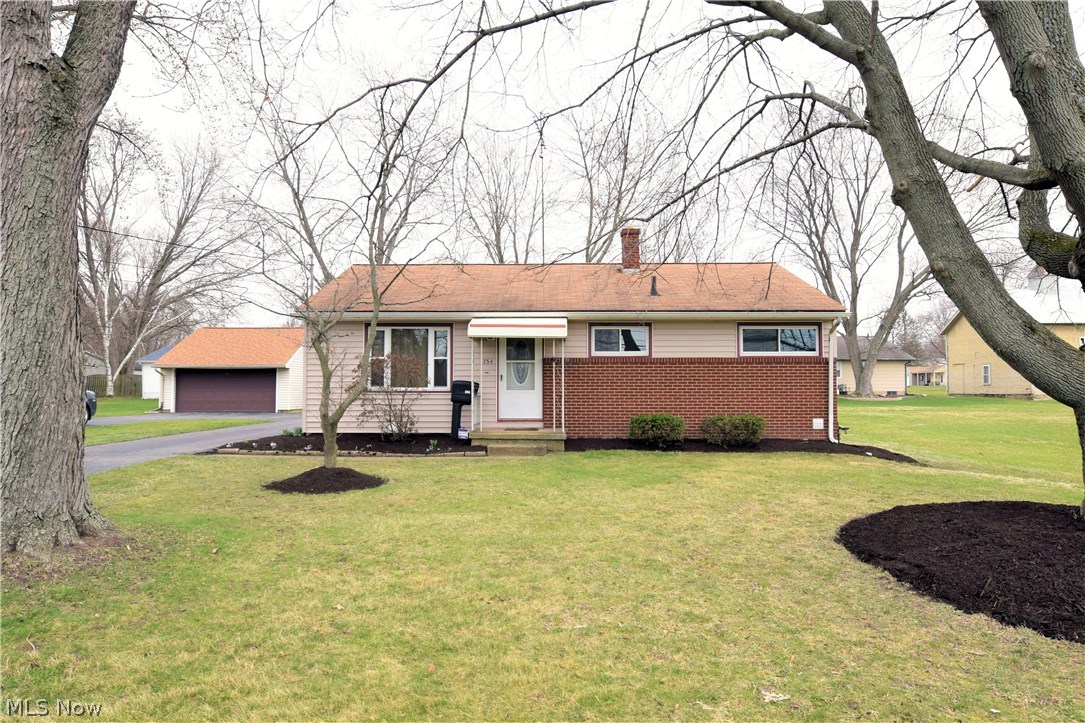 This cozy, updated ranch home has 3 bedrooms, 2 FULL bathrooms, and Lakeview Schools. Inside, light hardwood flooring connects the brightly colored and tastefully appointed rooms. The living room houses a large bay style window which lets in great natural light, hardwood floors, and newer front door. Eat-in kitchen remodeled in 2007 features Kraftmaid cherry cabinets, beautiful counter tops, hardwood floors, appliances staying, and dining area. Three first floor bedrooms offer plenty of usable space and great size closets. The updated main bath features a glass vanity and tasteful accenting tile work. A full finished basement makes way for a newly remodeled in 2015 family room with new carpet and glass block windows and separate laundry quarters. The basement is fully waterproofed by Ohio State Waterproofing. A detached two car garage and a well manicured yard round out this well cared for home. Additional features include: paved driveway, concrete sidewalks, washer & dryer stay, water