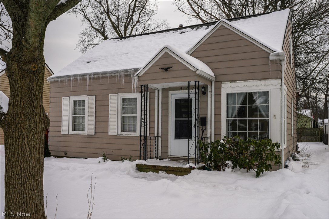 This three bedroom home is located in the heart of Cuyahoga Falls and is just waiting for a buyer to give it some love. There are wood floors on the first floor ln the living room, hall, and both bedrooms. The main bath has been updated with ceramic tile floors, and a newer tub surround. The kitchen has a newer refrigerator, and the upstairs bedroom would make a great master bedroom. It is roomy and has two large walk-in closets. The lower level has a large finished recreation room with glass block windows, and there is a laundry area that includes a washer and dryer. In this laundry area there is a commode and a shower. There is 100 amp electrical service. The roof was replaced in the last few years, and there is a detached one-car garage. The back yard is fenced on three sides, and this home is just three blocks from Lincoln Elementary School. Cuyahoga Falls is a wonderful community with a Parks and Recreation Building, Water Works Swimming Park, reasonable utilities, and it is close
