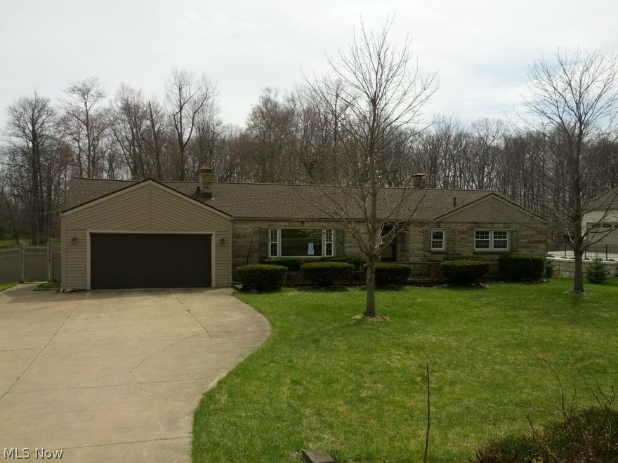 Calling all car buffs!!  Two car attached and three car detached garage.........WOW!!  This house is perfect for the car enthusiast or the family looking for some elbow room.  The quaint neighborhood definitely shows pride in ownership.  This lovely ranch boasts 3 nicely sized bedrooms up with full bathroom and 1 bedroom in the basement with full bathroom.  Perfect for the teenager looking to get far away from their parents without actually leaving the nest.  Lovely wood burner in the living room, well laid out kitchen and fabulous formal dining room.  Enclosed patio off of the kitchen, with French doors to the deck, would be a great place for an additional bathroom or first floor laundry.  Have dogs?  Your four legged friends will be sure to love the huge fenced in yard and enormous dog house equipped with electric and ceiling fan.  Newer windows, additional storage shed and finished basement are all added bonuses.  Additional lot# 7400521 included, making it a total of 1.62 acres.