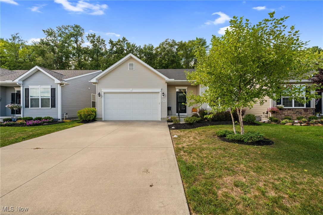 Welcome to 6472 Amber Way! Located in North Ridgeville's Meadow Lakes, this 3 bedroom 2 bath ranch is perfect for you! The home was built in 2018 with so many modern finishes such as LVP throughout the whole house, granite countertops and an open floorpan.
The living room offers a fireplace and lots of lighting. Beyond the open concept kitchen is a bonus bump out space that can be used as a sun room. The full basement is ready for your finishing touches- home was built with a rough-in to add a full bathroom! The modern back deck is a must see- relax while taking in the wooded North Ridgeville Metro Park that abuts this property. An added bonus of this home is year around maintenance including weekly lawn mowing, seasonal driveway snow removal, yearly mulch and more!
Be sure to see this home before it's too late!