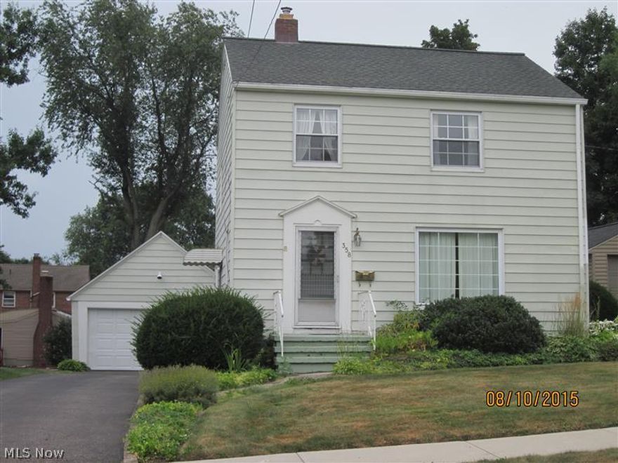 Welcome to exceptionally well kept, charming, 3 bedroom colonial.  Aluminum siding.  Features 2 car garage.  Property is well landscaped and provides quiet setting in rear yard to relax.  Quick possession.  Just move in and unpack.  Updates:  Electric panel box, furnace & A/C, humidifier & chimney liner, glass block windows in basement all replaced in 2007.  Home warranty provides & offers peace of mind to new home owner.