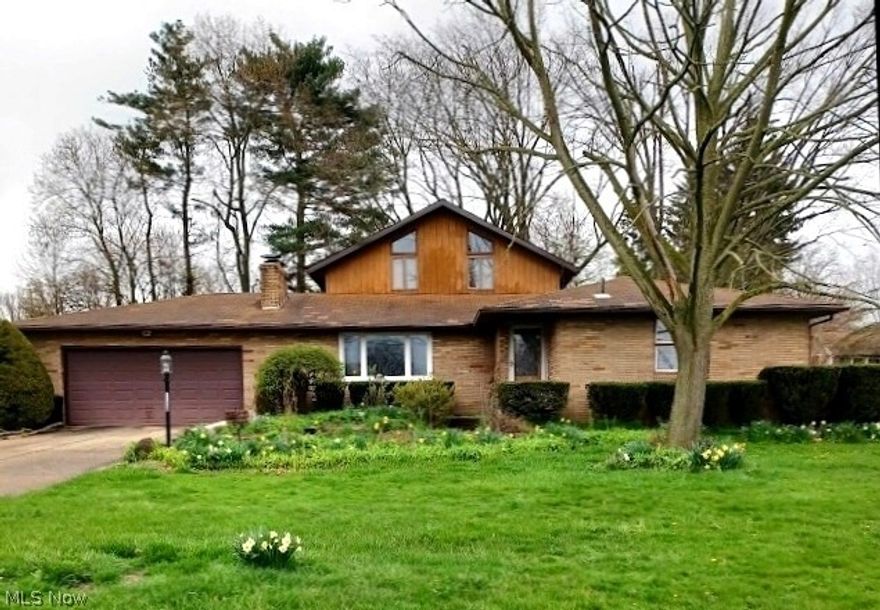 Executive home in a fine and friendly neighborhood.  Large, comfortable living room with woodburning fireplace.  Family room with cathedral ceilings, tall windows, Purgo and tile floors, custom designed brick wall with woodburner.  Custome built Oak spiral staircase.  Upstairs bedroom with full private bath.  Roomy basement is accessed through garage.  Elecrical service recently upgraded.  1/2 acre homesite.  House needs new interior paint.  Roof shingle colors do not match.