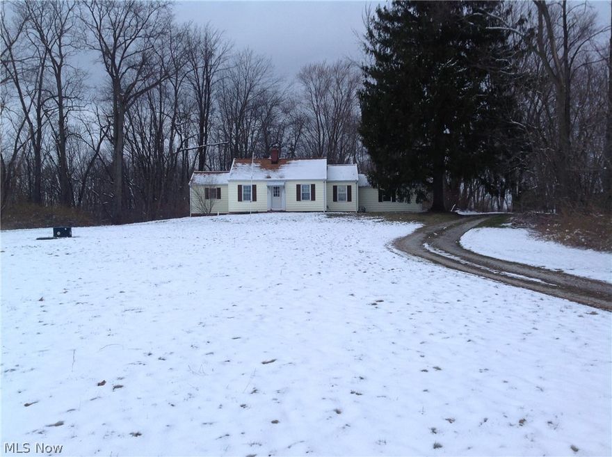 Aprox. 1 . 8  acres in Marlington school district. Ranch style. Sits up on a hill, Just a cute house waiting for a family starting out or slowing down, very private back yard. 2 or 3 bedrooms. eat in kitchen, formal dining room living room combo. 2 car attached, nice basement unfinished. Vinyl siding , most updated windows, septic new/ updated when seller purchased also city water put in at that time... IF you want country living at a reasonable price take a good look. Square foot and sizes estimated.