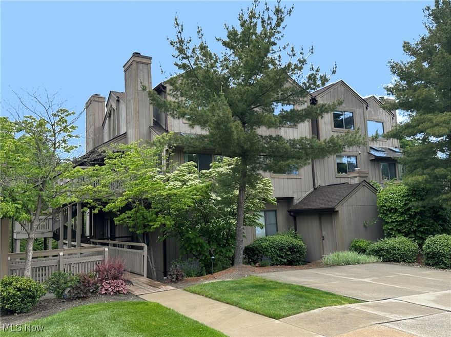 Tucked away in the beautiful Northampton area of Cuyahoga Falls, this beautiful 2-bedroom, 1.5-bath condo offers wooded views and the serenity of nature. Located in the highly desirable Pine Mill Ridge community, this condo blends peaceful living with modern conveniences. Step inside to find bright, open living spaces highlighted by large windows allowing for lots of light to flood in. The spacious living room features a cozy stone, gas fireplace and flows seamlessly into the dining area, and kitchen. The kitchen offers ample cabinetry, newer LVT flooring and countertops, and an eat in bar. The nicely sized primary suite and second bedroom both boast cathedral ceilings for a spacious feel. Enjoy the wood deck just outside the front door, offering the perfect space to sip your morning coffee or unwind while immersed in nature’s beauty. Additional highlights include in-unit laundry, newer LVT and carpet, community pool and conveniently located near the Cuyahoga Valley National Parks, shopping, restaurants and close proximity to Merriman Valley. If you're searching for a unique, maintenance free home with a scenic feel, this Pine Mill Ridge condo is a must-see. Schedule your private showing today and experience the perfect blend of privacy, nature and convenience!