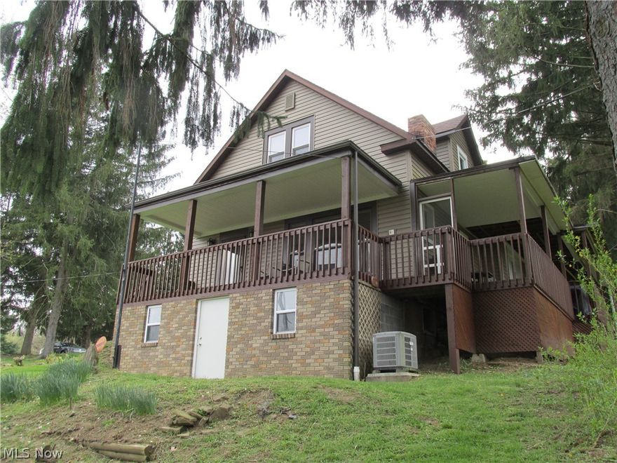 Shadyside!  Country living yet a stone's throw from village limits.  This home sits on slightly under one acre at .86.  A beautiful wrap-around partially enclosed deck showcases this meticulously maintained home that overlooks the village of Shadyside.  This home features a master suite and two additional upstairs bedrooms.  There are 2 full bathrooms with a downstairs/basement half bath with a shower.  The rooms are generously spacious, and did I mention meticulously well cared for?  The large living room leads out onto the deck, with a fabulous view.   Numerous updates including partial drywall, roof, and vinyl siding.  Newer flooring is just one of the many upgrades completing this move-in ready home.  There is plenty of space in the level back yard for entertaining or outbuildings.  The paved driveway offers ample parking.
