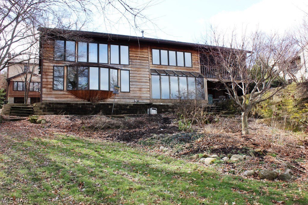 A must see to appreciate all there is to offer- 2 homes on East Reservoir-main chain of lakes (80' water front), former Akron Symphony Tour home plus 2 bedroom apartment (rented for $800/mo. is now vacant), a storage garage (35x22), 5 parcels (2 used for parking across the street, possibly buildable)* Tranquil views from most rooms including 2 story great room with plant ledge & wall of windows* Formal dining* Gourmet kitchen with granite, wood floor, huge walk in pantry, island/breakfast bar & vegetable sink* Vaulted master with lake view, walk in closet, built ins, shoe closet, private 16x7 screened porch & vaulted master bath* 2 additional bedrooms & guest bath* Family room with gas or wood burning fireplace, wet bar & opens to sun room with access to partially covered patio* Laundry with cupboards, counter space & sink* Multi level patio* Updated concrete sea wall with dock & 2 wave runner lifts* Fish pond & water fall* Spacious 2 bedroom, 1 bath apartment* Public sewer, private we