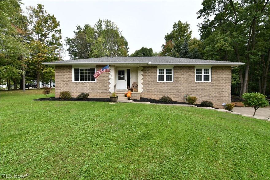 What a rare opportunity in Stow! This brick Ranch has 4 bedrooms, 3 full bathrooms, just over 3,000 square feet of living space (including the walk-out lower level) and sits on 4.1 wooded acres. There are beautifully refinished hardwood floors throughout (2015), along with a large eat-in kitchen with stainless steel appliances (2012). The family room has a fireplace and access to the outside living area (covered deck, totaling 400 sq. ft. of space). Adjoining the kitchen and family room is a perfect room that can be used as a den, sitting room or play area. There is a full bathroom for guests in the main hallway and a full bathroom located off the master bedroom. The spacious formal dining room is located in the front of the home and is great for hosting parties. The walk-out lower level features a bonus room that could be used as a 5th bedroom and also has another living area with a bar setup, a hookup for a wood-burning stove and plenty of room to have people over to watch the big ga