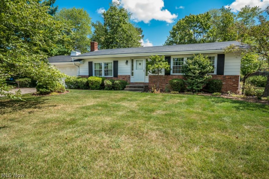 Welcome home to this cozy 3 bedroom 2 bathroom ranch that has plenty of curb appeal and almost a half acre lot. Enjoy the spacious updated eat-in kitchen with tile backsplash and plenty of cabinets and counter space. Step into the family room and spend time by the wood burning fireplace. The family room also features sliding doors that lead outside to the great sized backyard and concrete patio. The home has three very nice sized bedrooms. Laundry hook up is located in the basement that also provides plenty of storage space. Updates include A/C in 2002, Windows and Patio Door in 2002, Glass Block Windows in 2007, Gutter Helmet in 2005. 1 year home warranty included at a value of $399.