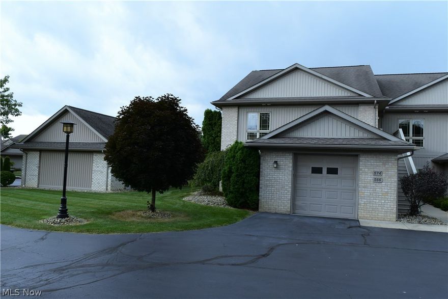 Stunning upper level condo available within walking distance to Lake Milton and includes amazing BOAT DOCK!! This open floor plan condo has many great features of which are hard to find. This property offers a lifestyle that most would put on there bucket list. Enjoy boating, golfing, walking, swimming, fishing. Other great features include the club house which has a meeting area, gym etc. This is a private gated community which strives to keep units well maintained. Parking garage nearby. 2 bedrooms and two baths, large rooms, walk in closets, private balcony and more. Schedule your private viewing now, Welcome Home!!  Potential land contract option