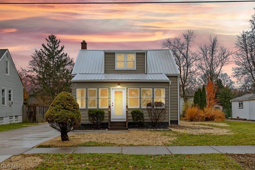 Just in time for Christmas! This rare, 4 bedroom home is just gorgeous! Completely remodeled kitchen, bath, and now boasts an additional bathroom; there is plenty of room to host the relatives. The list of updates is extensive. New metal roof, new flooring, mouldings, doors, plumbing, fresh paint, custom closets with built in shelving, custom light fixtures, cozy enclosed front porch, new garage doors with openers and NEW central air. Updated driveway, landscaping, large back yard. First floor main bedroom with walk in closet, full bathroom, and laundry. This home is cozy with all the right nooks and space for comfortable living.