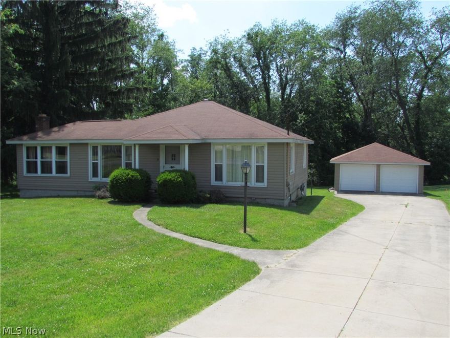 Nice Ranch style home with concrete drive and two-car detached garage, resting on nearly a half-acre lot in Springfield Township! Two bedrooms (with possibility for a 3rd). Great views of the private back yard out of the eat-in kitchen which has stainless steel appliances. Newer windows. Den with fireplace off the living room also leads out to elevated back deck. Walk out basement. High efficient furnace. With a little TLC this will be a great home! Sold as is. Schedule your showing today!