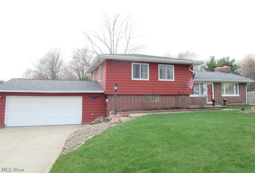 Love, care and good taste are the hallmarks of this 3 bedroom, Tallmadge split-level! One step in, and it’ll be clear how much thought the Sellers put in to improving the home. New carpeting flows through the main living areas. You’ll adore the 25 x 25 foot great room addition, with a soaring ceiling, built-in audio, a pellet stove that provides enough heat to heat the whole house, and it even has an exquisite coffee bar with running water and a fridge! The kitchen is absolutely gorgeous. The good-sized bedrooms are just a few steps up, and you’ll love the convenience of the nice utility area, a few steps down. Pottery barn, move over! The wall colors are fabulous, including the dining area that is open, painted in rich gold with white trim. It'll be a lovely back drop to your holiday dining table! The flow between the kitchen, the dining room and the family room is fantastic for entertaining, too. The roof is new and the back yard is a dream. There’s an enclosed porch with lots of w
