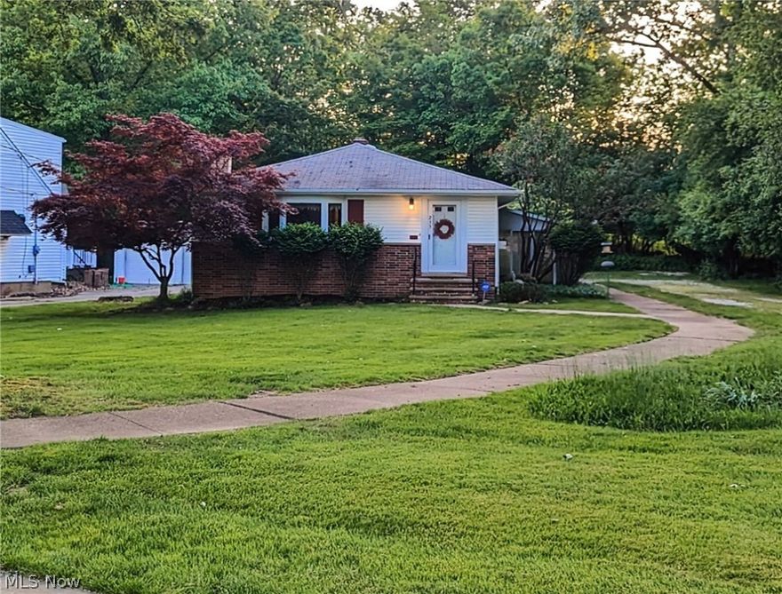 Welcome home! Charming both, inside and out, this property is loaded with desirable features. Inside you're greeted with a wood burning fireplace in the living room.  Easy first floor living with walk in shower. All utilities convey for a ready-to-use eat-it kitchen that boasts an open view to the living room and dining areas. Enjoy the enclosed patio year-around. The basement has a finished bathroom, ample storage, and endless possibilities for use --  All it needs is your personal touch! Newer windows & hot water tank.
   Outside, your personal walkway in front of the home leads you to the front door as well as along-side your three seasons room, connecting to your two-car garage with electric. With neighbors on one side, trees/ a small wooded area provides privacy to the other. Comes with a 1 year home warranty!