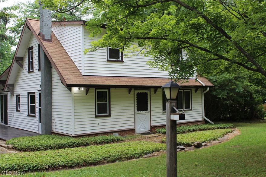 Come take a look at the updates  since the home was originally listed Down a winding tree lined drive is  this 3 bedroom home. Lots of privacy, and mature trees, even a patio off the family room. don't fall in love with the wall paper its been removed
Many upgrades have recently been made to the home including new roof , electric, paint in most rooms and carpet plus a price adjustment  Nice size rooms and bedrooms have beautiful hardwood floors. There is room to expand the 1/2 bath to full ( loft).'Family room has door to your deck, and laundry area is behind doors in family room. Family room can be arranged with your furnishing as media/ tv area. Come take a look at this freshened up home. 
Smaller bldg  ( built 1830) and moved to property many years ago, used as workshop/ office, great storage . and can be removed. No value is put on this out bldg. Buy now and start your enjoyment of this home, plan  your summer gatherings for this years and years to come.  Home warranty included .