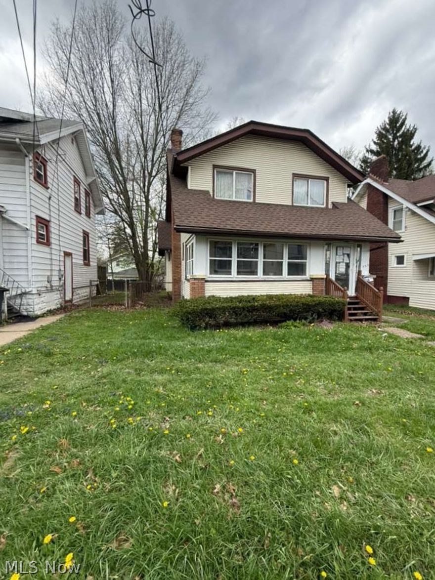 Looking for a solid, spacious Colonial with great potential? This well-built home offers a fantastic layout in a desirable location and is full of timeless character.

Inside, you'll find beautiful original woodwork, including rich wood doors, moldings, and trim, along with true hardwood floors throughout that can be refinished to restore their original charm.

Newer windows, roof, and siding to provide peace of mind for years to come. The home also features a dry basement with laundry, a cozy fireplace, a covered porch, and a fully fenced backyard, perfect for relaxing or entertaining.

Priced to reflect the opportunity, it's an excellent option for homeowners or investors alike. Agents welcome!