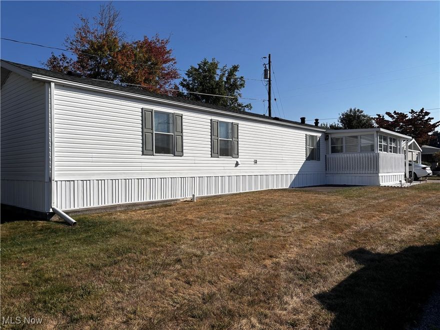 Westview Mobile Home Park is located midway between Akron and Canton, just off Rt. 21. This home built in 1997 is in excellent condition. This is not just a mobile home, it's a home home. With 1054 square feet, two spacious full baths, and a laundry room, this home has lots to offer. This home sits on a long-wise lot, giving spacious front and back yards, with trees, privacy, and room to play. A large 3-season front porch, 2-car concrete drive with a covered 2-car car-port, and a storage shed all added to the charm. The fully appliance kitchen you will also find plenty of cabinets along with a skylight. The way this home is positioned on it's lot allows for abundant natural lighting. Chippewa Golf Course is less than one minute away. This is a must see!