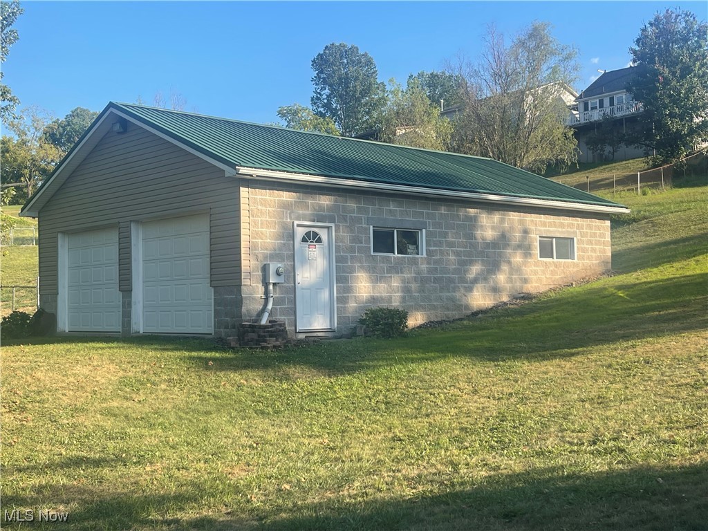 What an Opportunity!!! This 40' x 28" building with a Metal Roof features 10' Walls and 15' 3/4" Ceilings is a blank canvas!! Property Could be kept as a garage or finished out as a small 2-bedroom home or a duplex. Owner Built and used this for his wood working shop has 200 Amp Elect. and 56 electrical outlets!! Property has water & sewer taps at property (close to the telephone pole on right where you enter). On a 1/2 acre lot!!