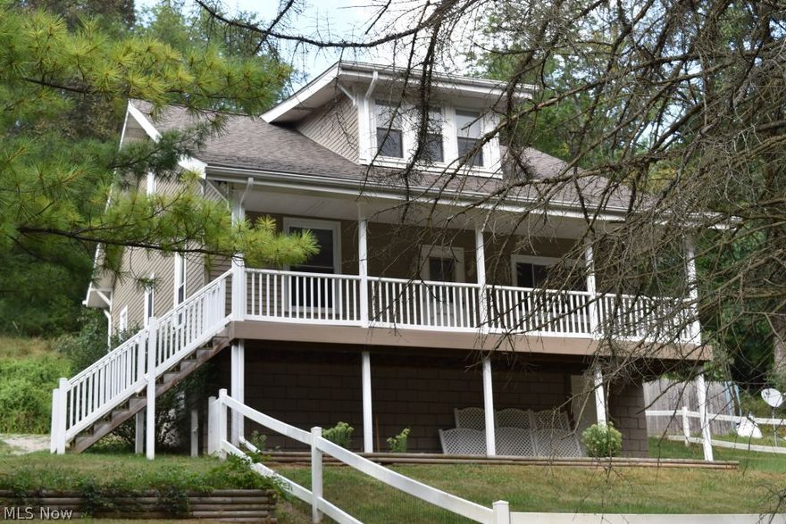 4 Bedroom home with 2 car detached garage on 1.19 acres. Newer shingles, siding, garage, and front porch.