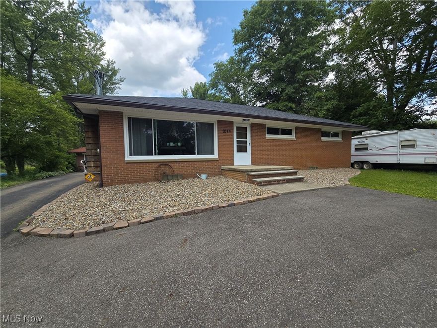 Welcome home to this charming brick ranch nestled in the desirable Green Local School District! Boasting three bedrooms and two bathrooms, this home is designed for comfort and convenience. The inviting eat-in kitchen provides a cozy space for meals, while the spacious living room features a stunning Buck Wood Stove fireplace and a large picture window that floods the space with natural light. Large partially finished basement with a full bathroom. Step outside to the expansive deck, perfect for relaxing while overlooking 0.69 acres of breathtaking views.
This property is packed with updates, including a new roof (May 2024), updated landscaping featuring a beautiful small pond (Summer 2024), and a freshly built deck (August 2023). A well pump and bladder tank were replaced in September 2022, accompanied by a chem-free water treatment system installed in January 2023 for added peace of mind. The fireplace has been replaced with a Buck Woodstove (November 2024), offering both warmth and rustic charm. A turnaround driveway added in July 2022 enhances accessibility, while Drylok basement sealing (April 2025) and updated house gutters (2023) ensure lasting durability.
Outside, the clean garage includes a convenient attached work shed as well as a potting shed for additional storage or gardening tools. Inside, the basement, first-floor bathrooms, and first-floor laundry have been recently remodeled, making this home move-in ready. Don't miss out on this gem—schedule your showing today!