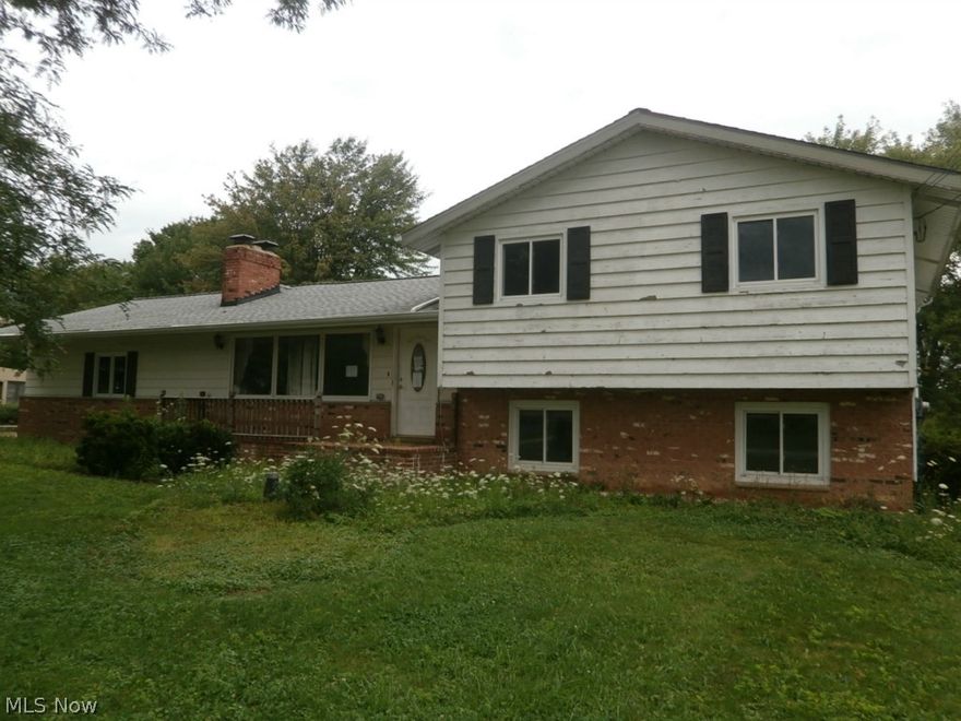 Imagination is what it takes! Four bedrooms with possible fifth bedroom in lower level, also used as an office. Split level home that needs some tender loving care, but the wonderful location and pretty grounds will make up for any problems. Open floor plan with lower level family room with fireplace. Just over an acre lot and 22x20 wood deck overlooks the rear yard! Make an effort to see this home today and make an offer! THIS IS A FANNIE MAE HOMEPATH PROPERTY.