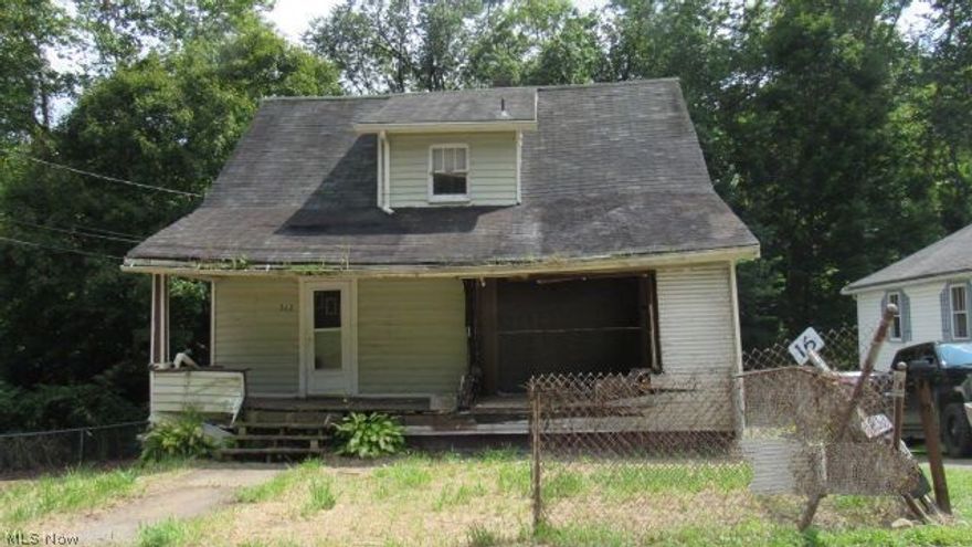 Need a project?  This 1.5 Story home  is for you.  This home is just waiting for a face lift or new structure so it can shine once again.    Bring those reconstruction ideas and make this home truly yours.