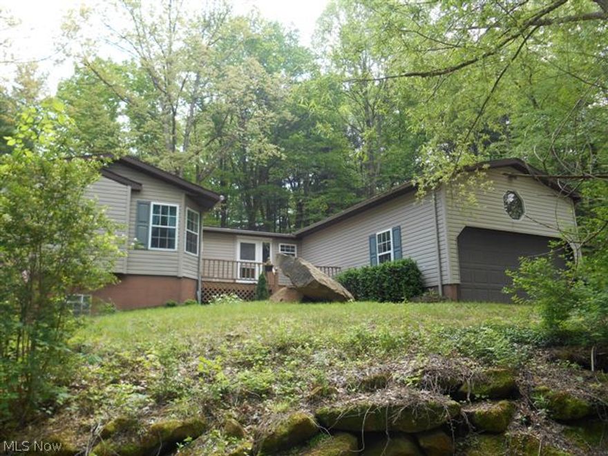 3 bedrooms, 2 full bathroom ranch home sitting on 4.6 acres. Enjoy 1 floor living including a kitchen with plenty of cabinet and counter top space, laundry/mud room, large living room with sliding door leading to rear deck, formal dining area, master bedroom with walk in closet, big master bath with garden tub and separate walk in shower, 2 more bedrooms and another full bath. There is a huge full basement, a 2 car attached garage, a car port and a 3rd car attached garage on the side of the house. This wonderful property has a new roof, public water, a back up generator, A/C and more.