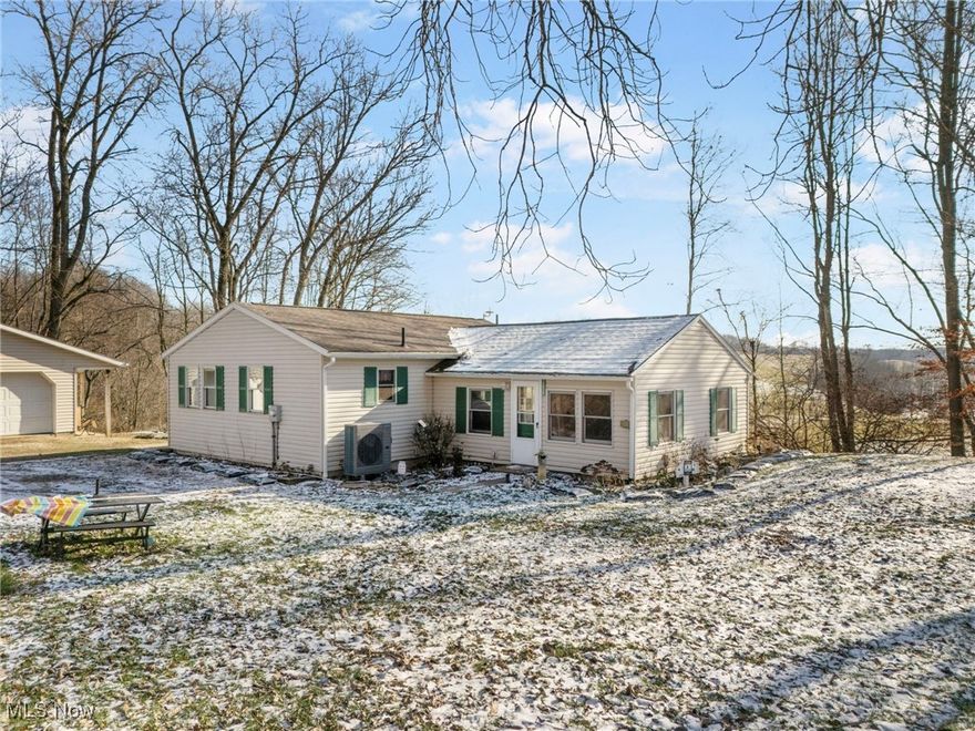 Welcome home! Are you looking for country living? This home has it all! 11424 Stucky Street S.E. features slightly over 5 acres of land with serene views of rolling hills. The property also offers a hunting shack, an 8x8 shed, a large chicken coop with an electric fence with its own solar source and an oversized 2 car garage with a covered porch as well as a yard drainage system! When you enter the home, you will find a generous sized living room open to the kitchen/eating area that features a custom built island and plenty of cupboard space. In addition, there are 3 bedrooms, one of which is currently being used as a sitting area. The unfinished, full basement is a blank slate for the new owners to use the space as they see fit. Maybe a home gym, office, or movie theater? The possibilities are endless. The property also includes 2 sump pumps, reverse osmosis, a water softener, radon mitigation system as well as a new heating and AC unit installed in 2024. Don't miss out on this wonderful opportunity! Call for a showing today.