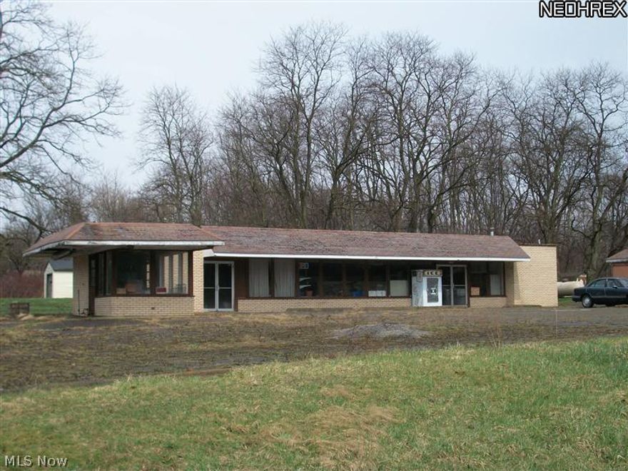 Commercial building with 2250 sq.ft. -200 amp service-septic & well. 1991 mobile home with 2 BR, 1.5 BA. According to the Health  Department there is one well and 2 septic systems.