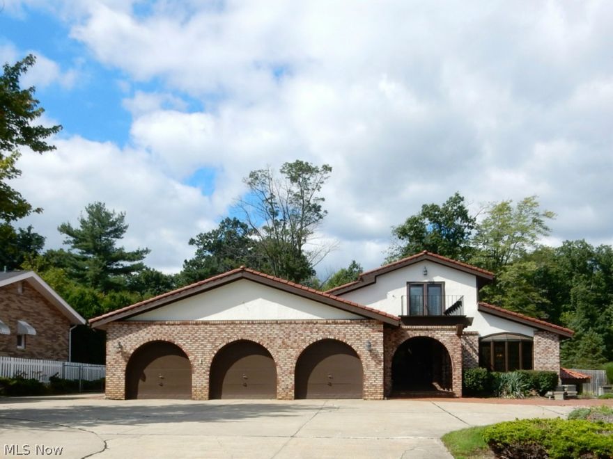 Entertainer's delight! First floor master suite with walk-out to patio. Formal dining room with marble flooring. Designer gourmet kitchen. Open floor plan. Lower walk-out level features whirlpool room, full kitchen, spa bathroom, bedroom, workout area, full bar and fireplace. Outside features in-ground pool.