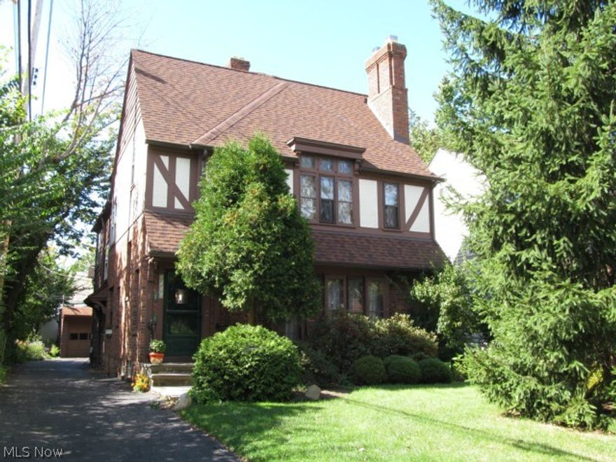 Enjoy this classic built Tudor Duplex. The architectural detail draws you into the charm and character of this well loved and maintained home. 6 Bedrooms and 3 full bathrooms. The property has 12 rooms in total, provides 2934 Sq.Ft. of living space and is on a 5600 sq.ft. lot with a 3 car garage with automatic garage door openers and key less entry. Each floor features beautiful hardwood floors, leaded windows, natural woodwork, working wood burning fireplaces, front and back staircase and enclosed back porches. Unit 1 has formal living room and dining room, 2 bedrooms and a full bath. Unit 2 has a vaulted living room ceiling, dining room. turned staircase, 2 full baths and 4 bedrooms. Great property as owner occupied or investment.