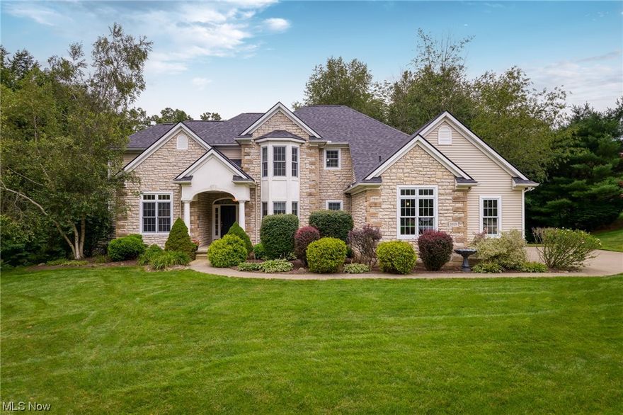 This one is a SHOW STOPPER! Gorgeous stone front colonial in sought after Pambi Farms with over 4000 square feet of living space and an open floor plan you'll LOVE!  Two story great room w/gas fireplace, tons of natural light and windows, built in whole house speaker system and a sliding door that leads to the 14x14 screened in porch & deck perfect for grilling!  The kitchen is a chef's dream with quartz counter tops, plenty of white cabinetry, stainless steel appliances, beautiful hardwood flooring, an eat in area perfect for seating 6 comfortably PLUS a built in wine refrigerator!  The spacious laundry room is conveniently located off the kitchen.   Dining room, office w/french doors & first floor 1/2 bath, too!  A HUGE first floor master bedroom w/ensuite bath complete w/jacuzzi tub, walk in closet & cathedral ceilings.  On one end of the second floor you'll find a generously sized bedroom w/full bath; head down the  hallway to two other large bedrooms that share a Jack & Jill Bathr