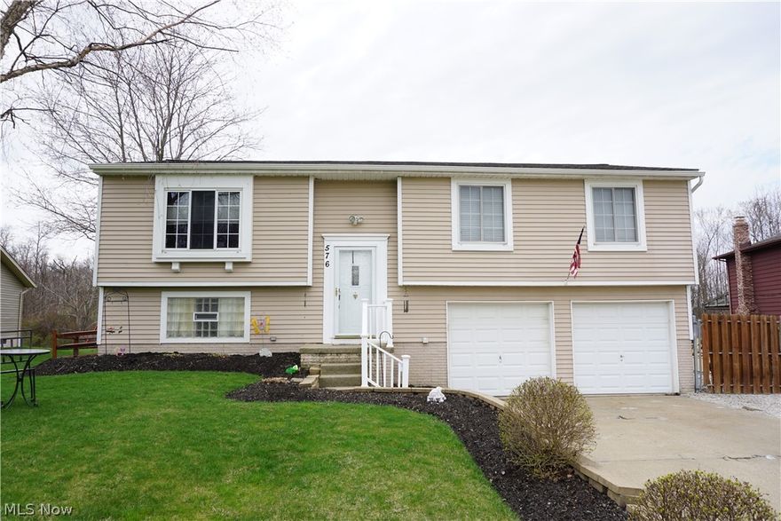 Welcome to this completely updated family home in a desirable Brunswick location.  Beautifully landscaped front invites you in to the open concept to a living room with wood-burning fireplace and dining room.  The kitchen boasts vinyl plank flooring, new cabinets, corian countertops and stainless steel appliances.  The dining area opens to an enormous trex deck that encompasses the entire length of the home.  The master bedroom hosts a remodeled full bath.  The two addition bedrooms are a good size!  The main bath has been completely remodeled and is beautifully done.  The lower level has a spacious rec room currently being used as a 4th bedroom.  A half bath, laundry room and storage is also found in the lower level.  The spacious, fully fenced in yard backs to woods and empty green space.  Fenced in garden space and play house with electric can be found in the back yard in addition to a huge patio space perfect for entertaining!  The side of the home has a large gravel drive perfect for a RV, boat and extra car parking.  Replacement windows, newer roof, updated furnace and AC and new exterior doors.