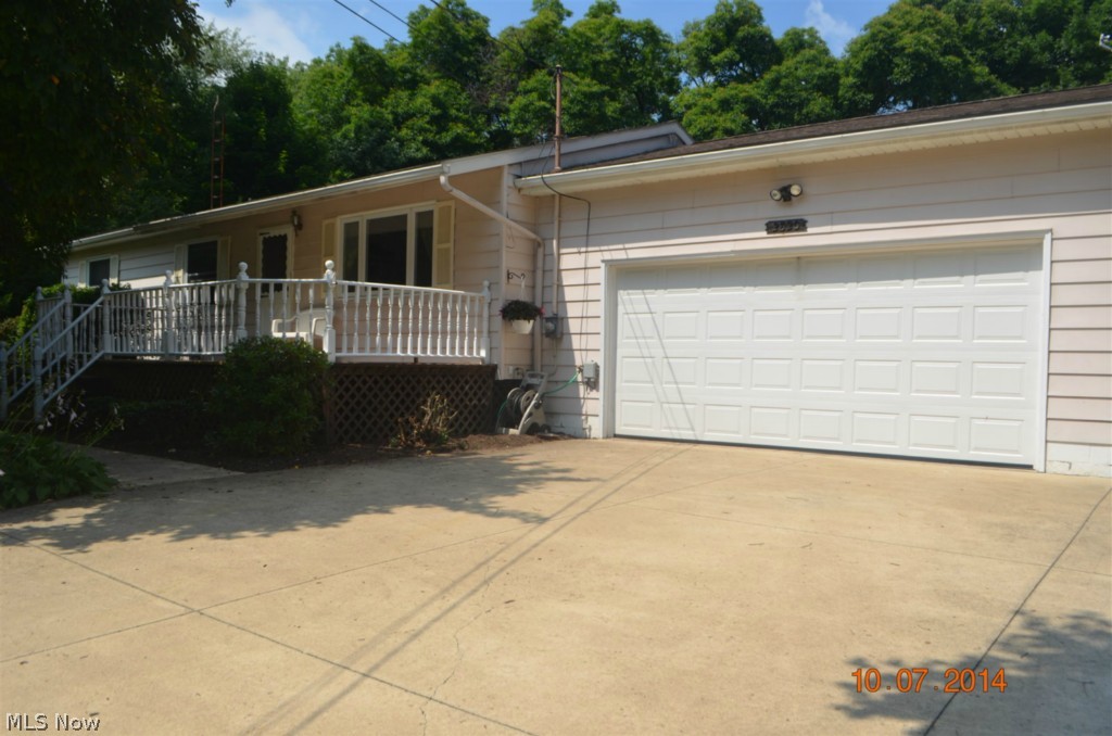WOODSHOP included with built-in vacuum system. New aeration unit (septic) 2011, furnace 2011, well pump 2011, sump pump 2010, hot water heater 2009, hardwood floors, wainscot, new cement patio and driveway, and other updates. You will love this beautiful, private, wooded backyard situated on quiet cul-de-sac street. Additional cemented parking/basketball next to 2 car garage. Green schools and easy access to major highways.