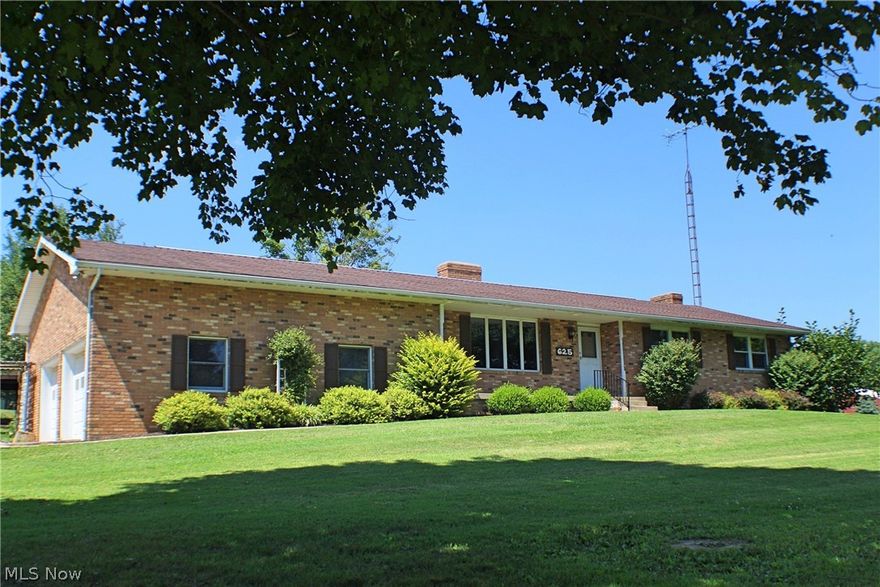 Beautiful brick home in quiet country setting on 3+ acres. Short distance from Route 40, conveniently located close to Zanesville and Cambridge. 
Spacious kitchen, large dining room, fresh interior paint throughout. Wood burning stoves in basement. New heat pump and C/A installed in 2020. Lanai with concrete floor and cozy brick fireplace outside, just off the garage.  Very large pole barn, 48x36, with a glassed in workshop 48x14 which  provides additional 672 sq ft. Also attached is a covered pull through storage open area 48x21,  perfect for camper, boat or equipment storage.  Door in main area of the barn opening is 12' wide x 10' high.  East Muskingum Schools.
Ridge Oil owns the mineral rights to this property, the new owners will receive any and all proceeds of the owners cut.  Their contact info supplied at closing.