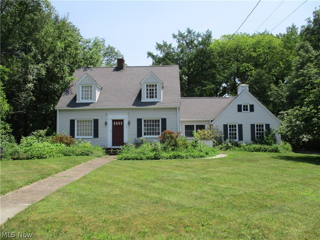 This charming 3-bedroom cape has beautiful hardwood floors throughout and built-in shelves, china cabinet, and pantry. One full bath upstairs and a half-bath on the main floor. It sits on a beautiful double lot in a great neighborhood within an excellent school district. The .75-acre property includes many flowering perennials, unusual trees and a shaded wooded area at the back with a hammock for relaxing. A bonus detached 14’ x 18’ foot barn-style workshop has full electric and a loft. The roof was replaced in 2010, there is an attached two-car garage, and the long asphalt driveway has additional parking areas. Family room with wood-burning fireplace for welcoming guests has a window looking out into the back yard, which is perfect for feeding birds and enjoying nature. Eat-in kitchen with a bay window. Den or office on main floor could be used as a fourth bedroom. Full basement has glazed dairy tile. Finished breezeway with closet space. Move in and enjoy your summer activities on th