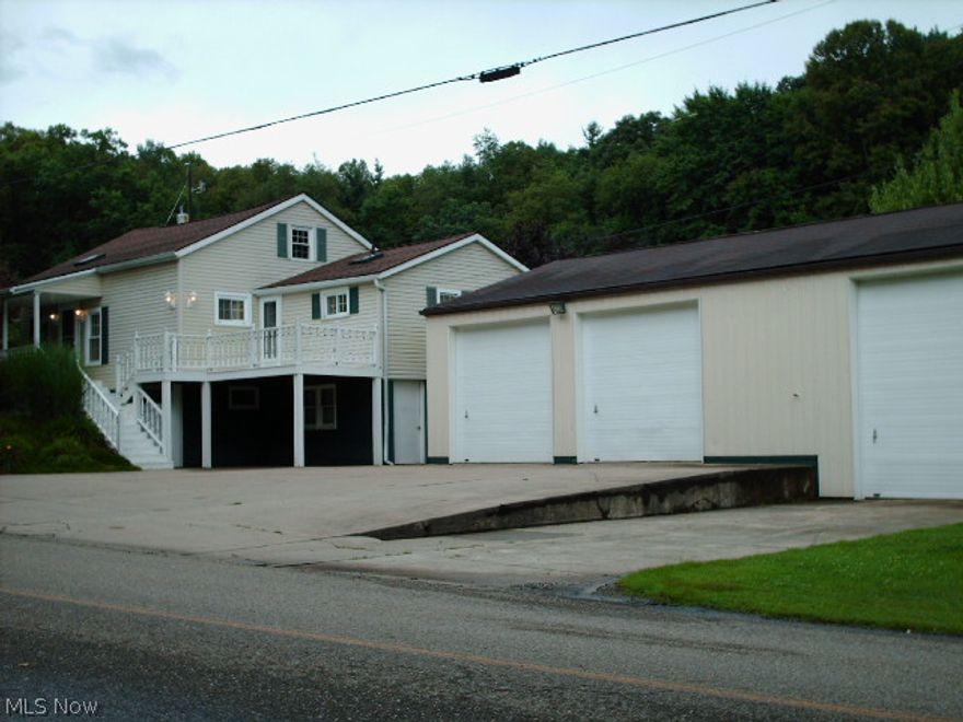 Property lends itself to many uses. 3 car detached 28 X 44 garage heated with oil furnace, has downdraft paint booth, 8 X 12 Heat and Air Compressor room. Includes 5HP 2 Stage 18CFM compressor with under ground power air and phone to rear garage. Paint booth is 12 X 28 X 12H with auto hoist (needs serviced).  Rear garage 30 X 60 X 10'H has gas heat and A/C. Dry wall finished. House has 17 KW Generac whole house stand by generator. Home is charming with finished rooms in walk out basement. Park like yard - Beautiful!