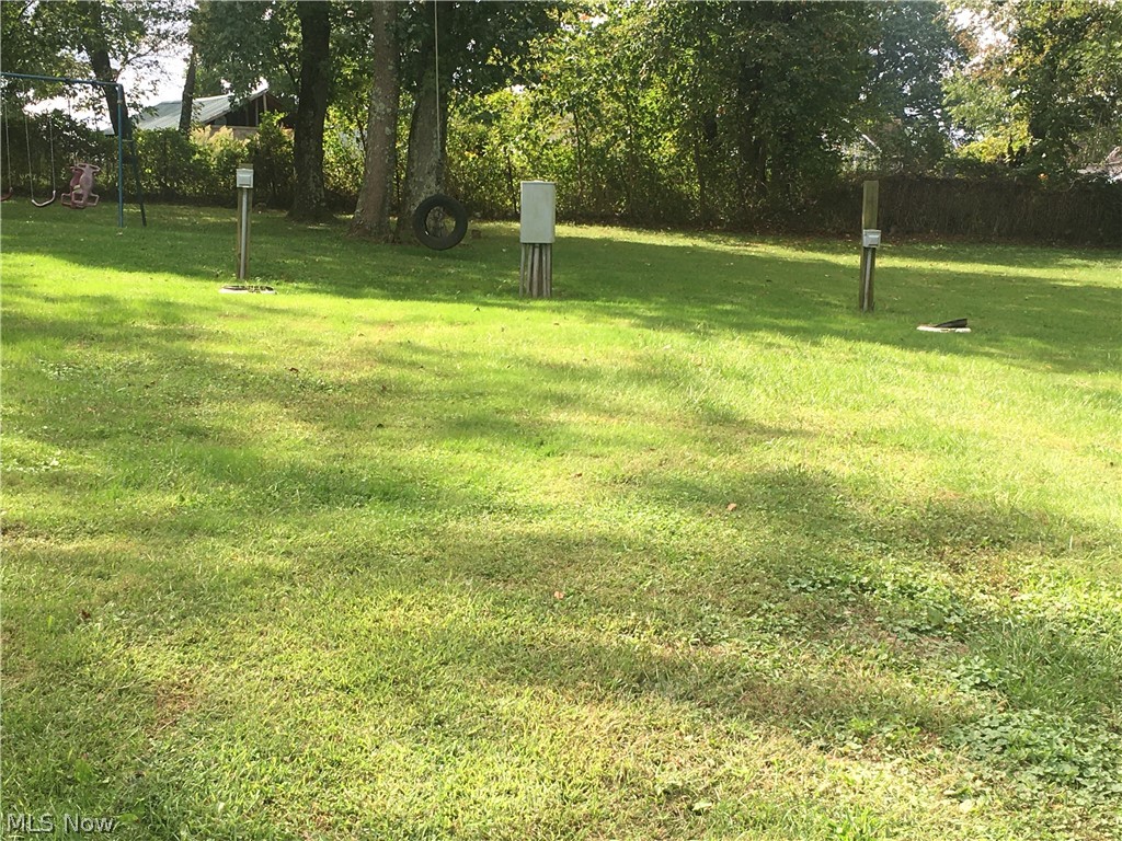 Are you looking for a Building site, Camper or Trailer Lot? This over 1/2 acre lot comes equipped with 4 sewer hook-ups, 4 water hook-ups and 4 electric 50 amp hook-ups. Take your pick...building a home, place a Trailer or renting it for 4 camper lots.