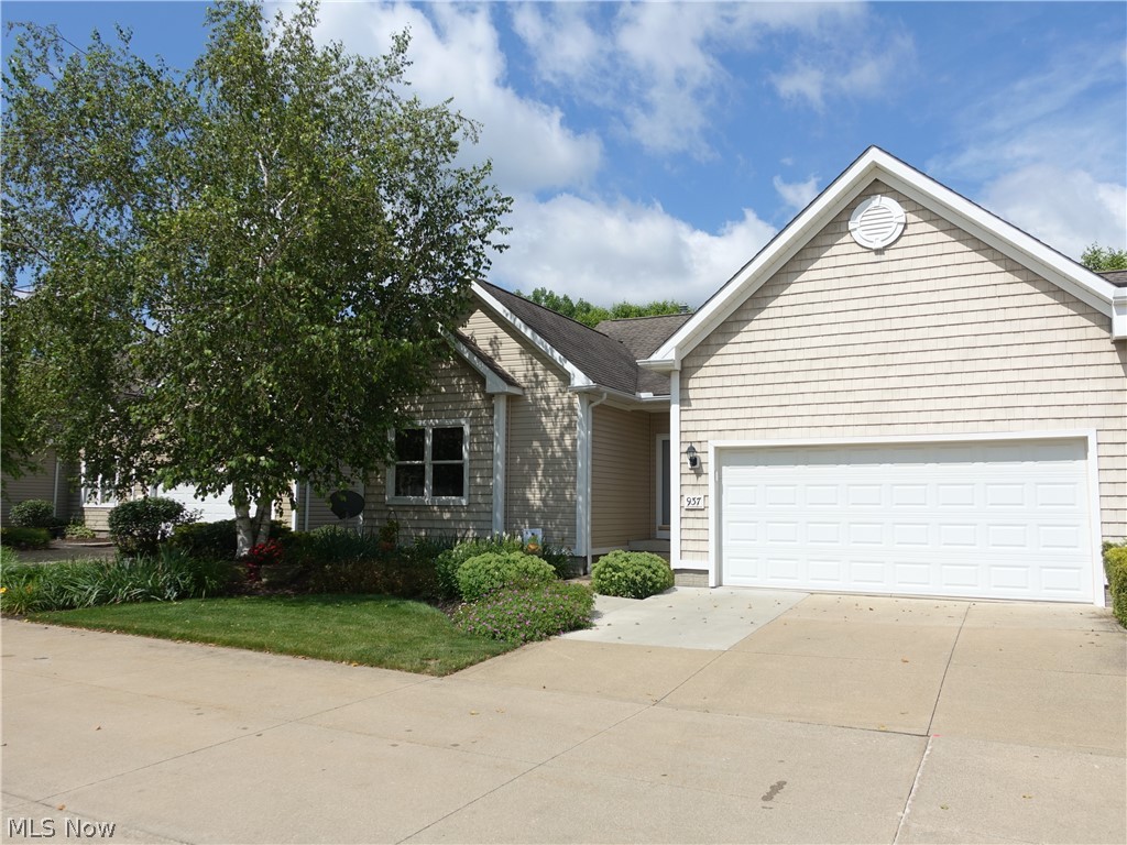 This is the home you have been waiting for * Magnificent and Meticulous are just a few words that describe this lovely first floor living property!
Inviting great room with vaulted ceiling & fireplace are open to the kitchen, which offers updated cherry cabinetry and newer appliances, pantry and breakfast bar. Sliders off the eating area to the 3 season sun room offer beautiful views of the lake, landscaping and especially the sunset! Spacious master features vaulted ceiling, walk in closet & master bath complete with double sinks, soaking tub and walk in shower. Love the First floor laundry/mud room! The dining area, 2nd bedroom + another full bath complete the 1st floor. You or your out of town guests will love the walkout lower level, which features a finished rec room, mini kitchen/bar, 3rd bedroom & full bath! Sliders to the concrete patio and private backyard are yours to enjoy - sunsets and lake are gorgeous. There's also another finished room currently used for an of