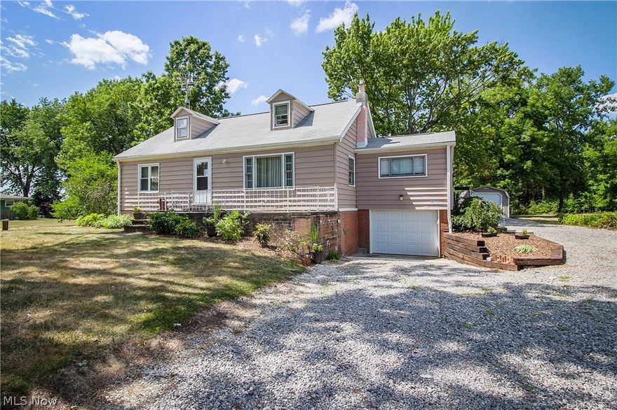 Much larger than it looks with over 1600 sq. ft. and over an acre of land!  You will be amazed at the amount of space in this 5 BR Cape Cod in the Marlington school district.  Step into the living room with neutral decor and gorgeous hardwood floors.  Head into the dinette area which includes a newer sliding door to the back yard plus new vinyl flooring that leads into the kitchen.  The kitchen features newer appliances, stone back splash, under cabinet lighting and updated counters.  Just off the kitchen is a mud room that leads to the side door.  Down the hall you will find the master bedroom with hardwood floors, plus two additional bedrooms, one of which is currently being used as an office.  The full bath has been nicely updated with newer vinyl flooring, vanity and tub shower combo.  Upstairs there are 2 more large bedrooms, both with hardwood floors and dormers that make for great storage space.  The full unfinished basement has walk out access, making storage of larger items a