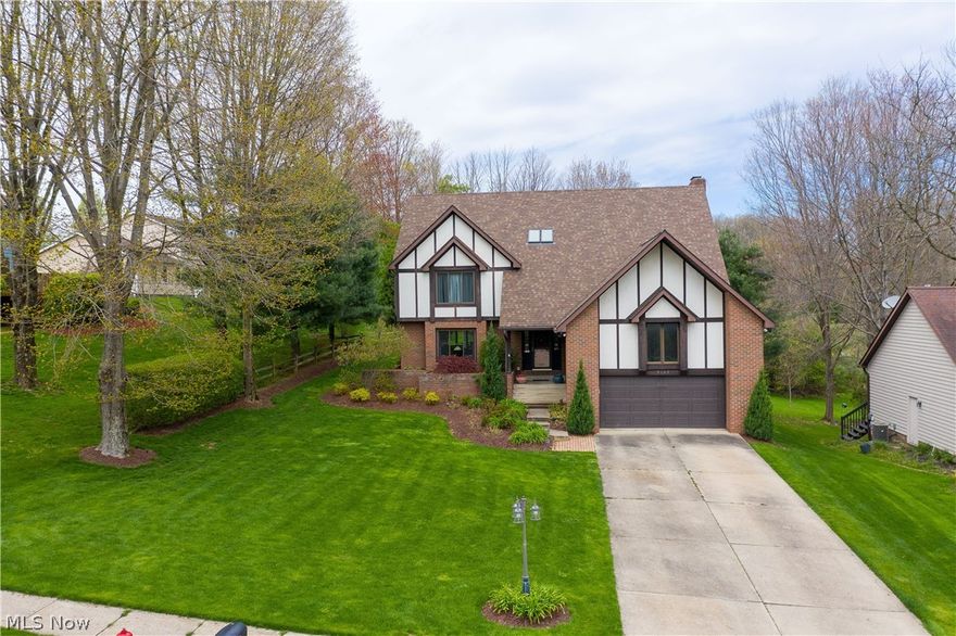 Meticulous, super sharp & updated contemporary colonial in beautiful Surrey Hill Estates!  This updated 4 bedroom, 3.5 bath home will impress you the moment you walk in the front door thru the 2 story foyer.  Combination living/dining room with hardwood flooring is open to the all season vaulted sun room, which has large  windows allowing for an abundance of natural light and has sliders to the huge deck.  Updated kitchen features lots of cabinets, pantry,  SS appliances, granite counters, nice eating area, which leads to a family room with gas fireplace and another set of sliders to the deck.  1st  floor laundry room & powder room complete the 1st floor.  All bedrooms are spacious & feature nice closet space.  The master is exceptional offering a large walk in closet with California organizers, updated master bath with skylights, new jetted tub, double vanities and granite counters.  The walk out lower level is totally finished featuring separate spaces - recreation room/media room, full bath, craft area and office /bonus room with wood burning fireplace and sliders to the beautiful backyard.  Enjoy the backyard oasis this summer with the awesome above ground heated pool with composite decking, fire pit area, and shaded gazebo to relax.  Whole house water filtration system.  Other updates include roof (2013/50 year shingle), furnace/CA & windows (2012), tank less water tank & water softener (2015); heated pool with composite deck (2016), laundry/master bath (2018).