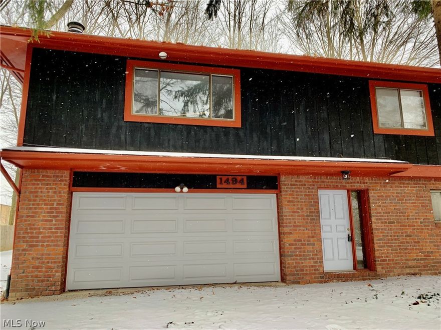 Dont miss this exceptional rental in Stow! Many new updates throughout this townhome style apartment. The main upstairs level offers a huge and sunny living room, dining room, huge fully applianced kitchen with plenty of counter space! Pantry and desk area in kitchen as well. There are 2 huge bedrooms and a nice sized full bathroom. Off the dining room is a lovely back deck overlooking a large and wooded lot. On the first floor you will find the attached oversized 2 car garage, a laundry and mudroom, a bedroom/den/office and a second FULL bath!! This home has it all! Brand new luxury vinyl tile floors and counters.  Dont miss it! All adult occupants must apply online. $50 app fee per person. We run credit, criminal and eviction history, plus income verification. No section 8 no indoor smoking.