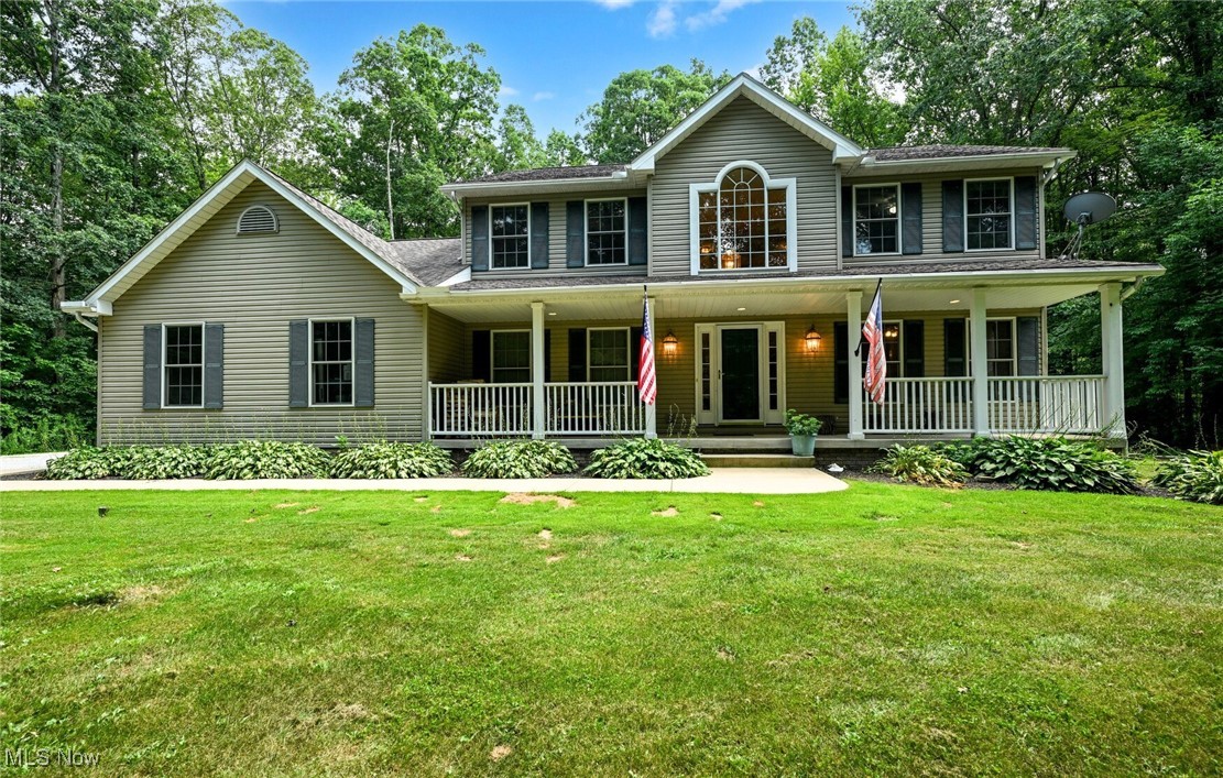 SECLUDED 4-Bedroom, 2.5-Bath Home on 4 Private Acres! Tucked away on a beautifully wooded lot with a generous setback from the road, this home offers the perfect blend of privacy and space. Step inside to a welcoming foyer that opens to a versatile bonus room with French doors perfect for a home office, playroom, or fitness area. The main level offers a seamless flow between the living room, spacious formal dining room and family room with a wood burning fireplace. The spacious kitchen is ideal for entertaining, with easy access to a mudroom and convenient first-floor laundry. Upstairs, the primary suite serves as a private retreat with its own en-suite bath, while three additional bedrooms and a full bath provide plenty of space for family, guests, or flex space. The poured concrete-walled basement with extra ceiling height is a blank canvas, offering endless opportunities for your customization. Enjoy morning coffee and host gatherings on the expansive private deck with built in benches and planters. Whether you're dreaming of cozy bonfires, a peaceful private retreat, or simply private space to roam, this is your chance to create the lifestyle you've always imagined. This home has it all - space, charm, and a setting that feels like a private nature preserve. Schedule your showing today!