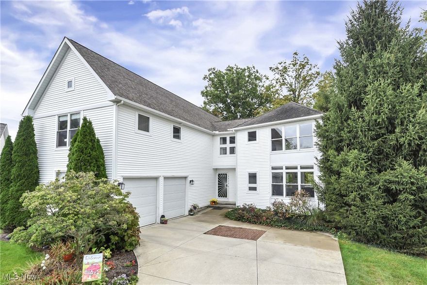 Welcome to 2839 Gates Court, a beautiful home nestled in MacIntosh Farms in Broadview Heights. This spacious 4 bedroom, 3.5 bathroom residence is located on a quiet cul de sac street with a rear yard wooded area for privacy. The home has a modern contemporary feel, with extensive windows and glass sliders for a light and bright feel. Wood flooring throughout the first level and second levels. Two story great room with soaring windows, gas fireplace with wood mantle/trim, marble hearth, and rear deck access. The open loft area and staircase create a dramatic look and feel in the great room. The kitchen features a large eating area, breakfast bar, wood flooring and stainless appliances. Great space for entertaining. Additional deck access (two) including a screened in deck area. Hallway off the kitchen separates the half bath and garage. The lower level is a walkout to a quiet yard with a rear wooded area. The lower level has great flexibility. Currently used as a family room area, separate bedroom with a full bathroom. This flex space has the functionality and size to be used in many ways. The unfinished mechanical room includes a 2023 tankless hot water heater. The bedroom level has two spacious secondary bedrooms with a Jack and Jill bathroom. The master bedroom has cathedral volume ceilings, open architecture walk-in closet, and master bathroom with soaking tub, double sink vanity and tiled shower. Second floor laundry, large storage closet and loft area are great value adds for your use. The two car side-entry garage has a notched out work area with built-in cabinets. Recent updates in: 2025...powder room, motorized blinds in great room. 2024...Master bath update, great room sliding door, Central Air unit. 2023...Tankless water heater, kitchen fridge, dishwasher. 2022...washer / dryer, upstairs flooring. 2021...new porcelain flooring in Jack/Jill bath. Development has three pools walking trails, tennis courts, and numerous amenities. Call today for information.