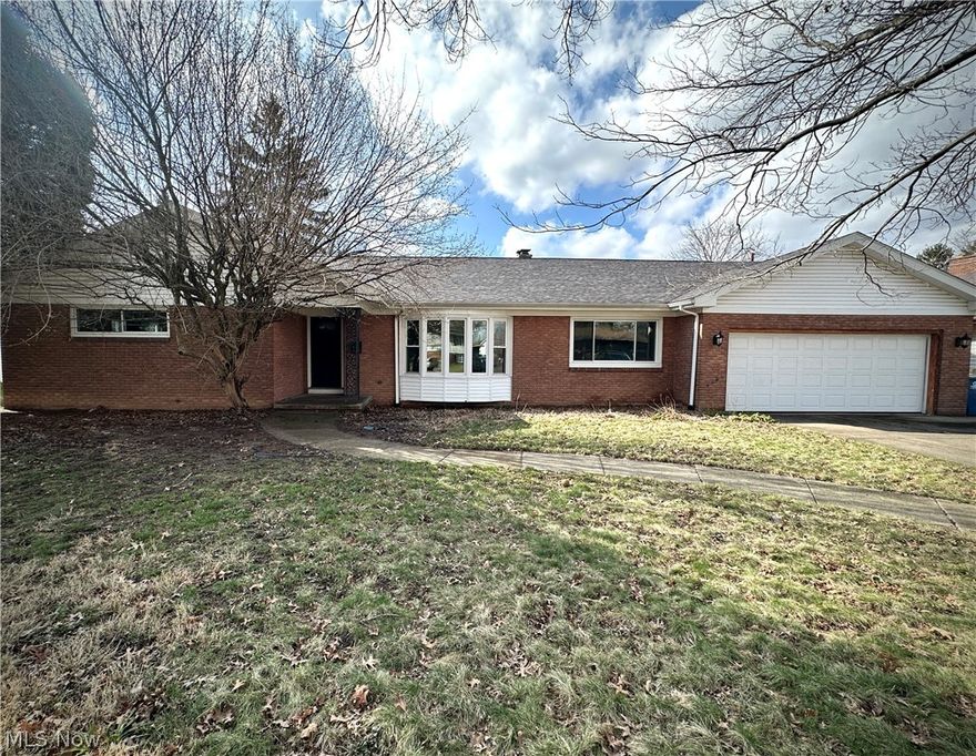 This sprawling brick ranch in Liberty is perfect for hosting family and friends. Step through the front foyer into a spacious, multi-use living and dining room. The updated eat-in kitchen boasts newer cabinets, countertops, stainless steel appliances, ceramic floors, and a casual eating area. Just off the kitchen, you'll find a convenient first-floor laundry and a half bath. The back family room offers a cozy spot to relax by the wood-burning fireplace, with sliding glass doors leading to an enclosed back porch. You'll also notice the ample closet space throughout the home with plenty of hallway storage. Down the hall are two guest bedrooms, an updated guest bath, along with a master suite featuring two closets, built-ins, and an updated bathroom with a walk-in shower. Conveniently located with an easy commute to amenities and major highways.