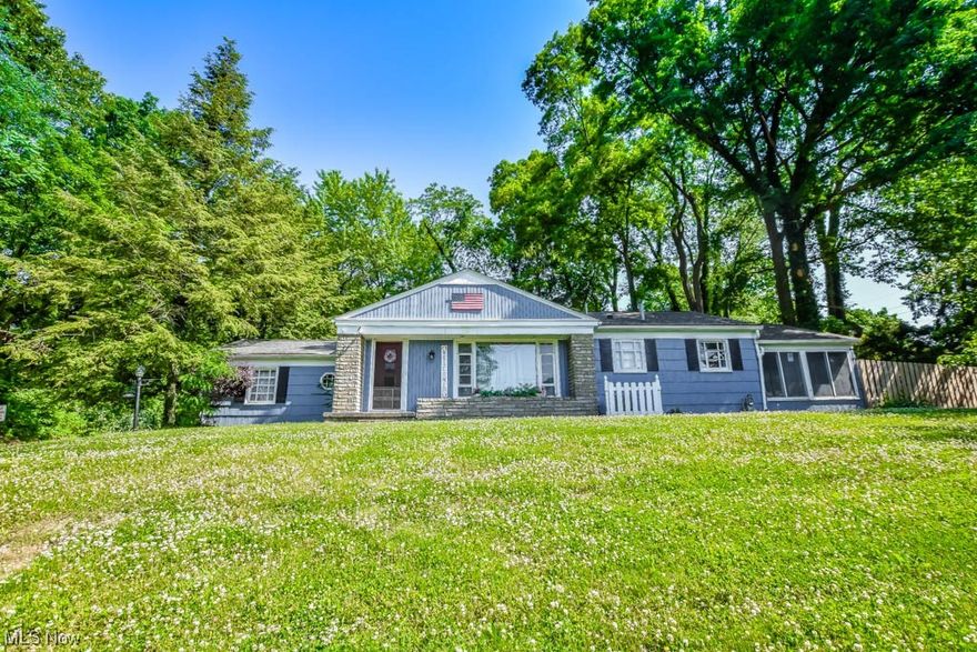This charming Massillon ranch offers the perfect blend of space & comfort, featuring 2-3 bedrooms & a 1/2 acre lot with a fully fenced backyard. The versatile floor plan boasts a welcoming living room with vinyl plank flooring, complemented by a large picture window that fills the space with natural light. Connected to the living room is a cozy dinette area, creating an open & inviting atmosphere. The kitchen is generously sized & comes fully equipped with all appliances, along with a beautiful mosaic tile backsplash. Adjacent to the kitchen is a versatile home office, featuring a beamed ceiling, which could easily serve as a 3rd bedroom if desired. Both dedicated bedrooms have access to the full bath, complete with a tub/shower combination & linen storage. Additionally, the 4 season sunroom serves as a delightful retreat throughout the year offering a tranquil spot to relax & unwind. A guest bath & laundry are added conveniences. Completing the interior features is a full basement, pr