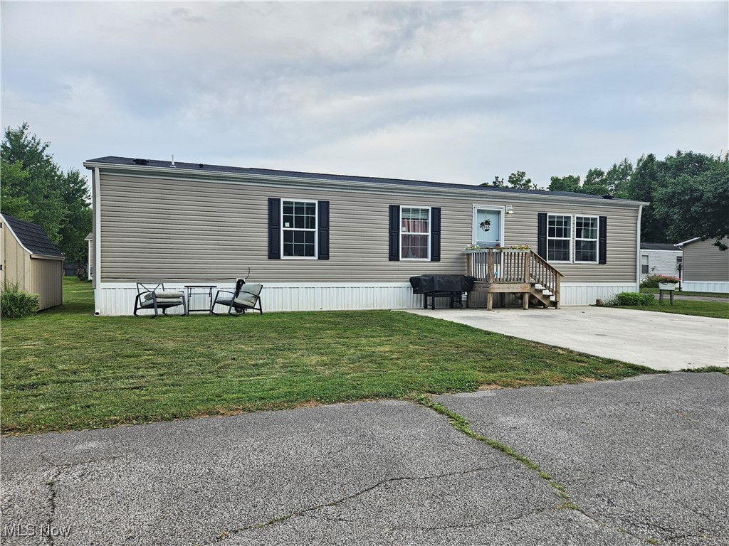 Welcome to 144 W Monroe Cir, Jefferson, OH 44047 a modern 3-bedroom, 2-bathroom mobile home built in 2021, offering approximately 1,344 square feet of comfortable living space. Located within the Jefferson Mobile Estates community, this home provides a blend of contemporary design and community amenities. The open floor plan seamlessly connects the living, dining, and kitchen areas, creating an inviting space for daily living and entertaining. Equipped with sleek appliances, ample cabinetry, and a functional layout, the kitchen is both stylish and practical. The primary bedroom includes a generous 10 x 9 en-suite bathroom, offering a private retreat within the home. Two other well-sized bedrooms provide flexibility for family, guests, or a home office. A large community clubhouse with a full kitchen is available for residents to host events and family gatherings at no extra cost. The community features a playground and picnic area, perfect for children and outdoor activities. Situated just off Route 307, the community offers easy access to major routes like Interstate 90 and Route 11, making travel to nearby cities and attractions straightforward. Jefferson is approximately 10 miles from Ashtabula, the largest city in Ashtabula County, located on Lake Erie. This proximity allows residents to enjoy various recreational activities, including fishing, boating, and beach outings. Additionally, golf enthusiasts can find scenic courses in the area. This property offers not just a home, but a lifestyle within a welcoming community.